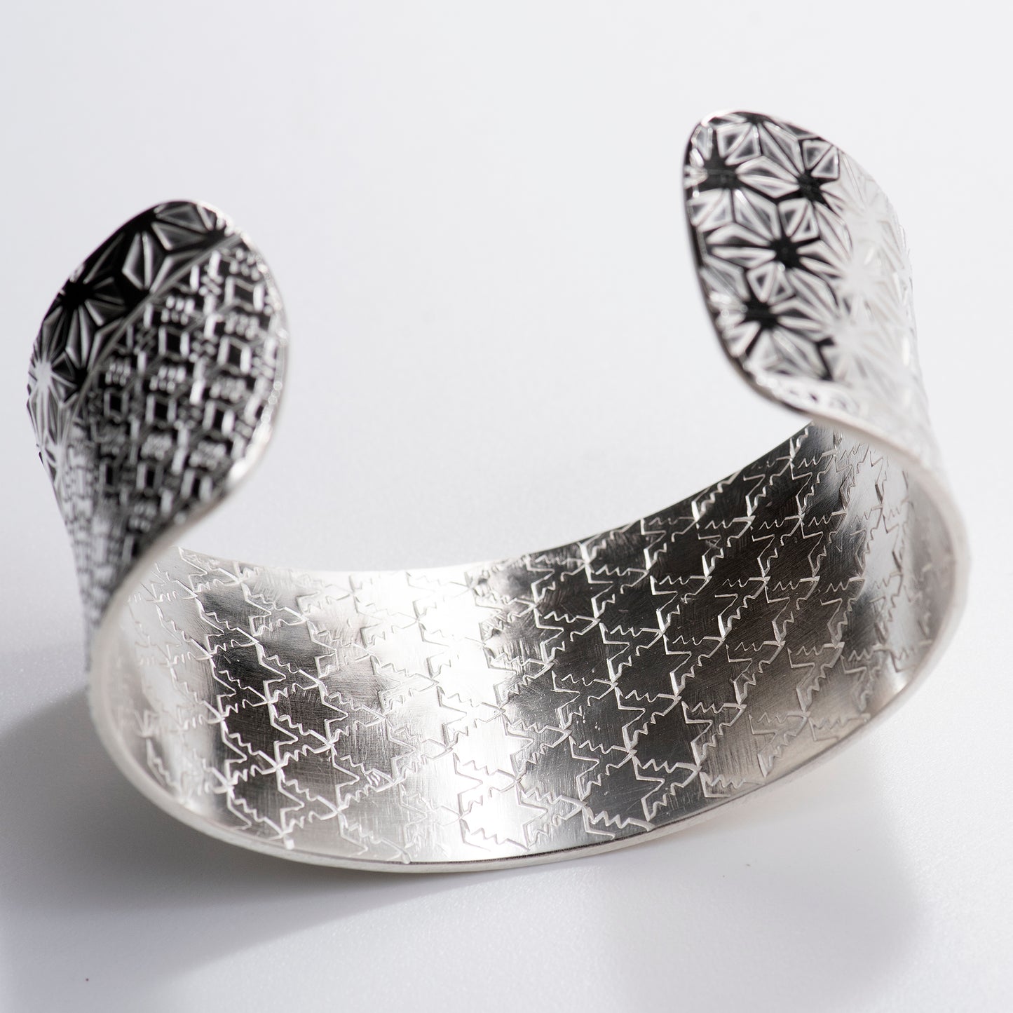 Anticlastic Cuff Featuring Hand-Stamped Traditional Japanese Asanoha Pattern and Repeating Triangle Pattern